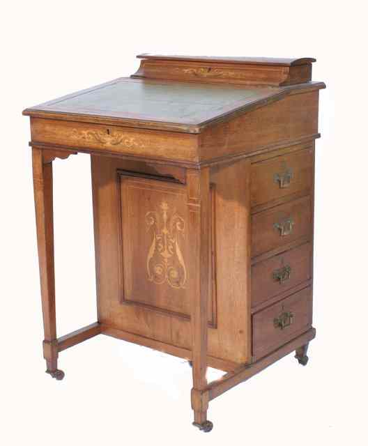 Appraisal: AN EDWARDIAN MAHOGANY INLAID DAVENPORT with pen box over green