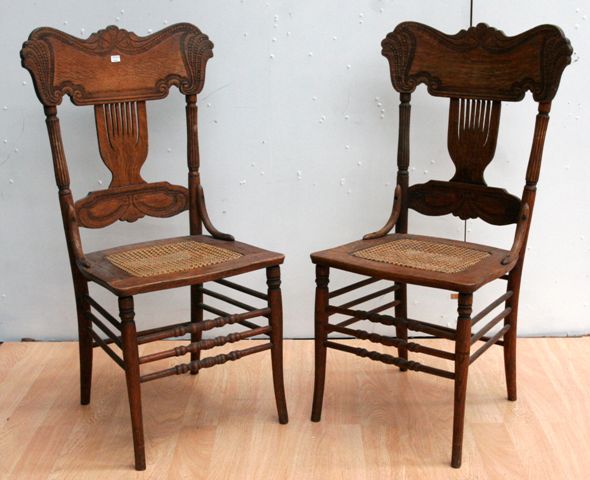 Appraisal: A pair of th century Australian oak and caned chairs