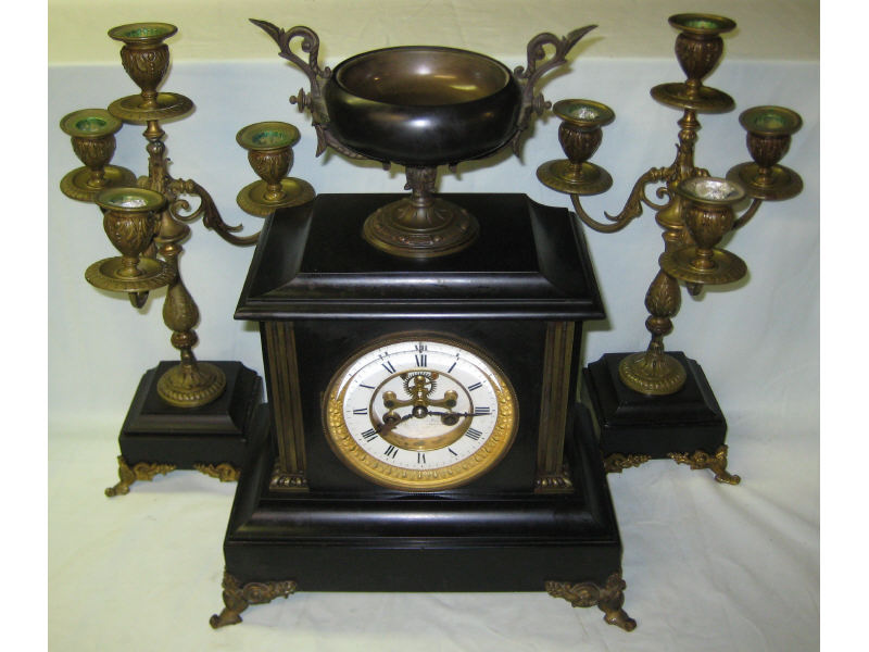 Appraisal: CONTINENTAL TH CENTURY CLOCK GARNITURE Of black slate with gilt