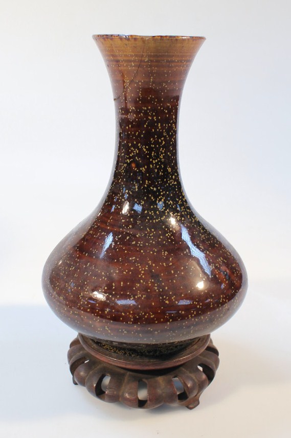 Appraisal: A Chinese earthenware vase the bellied body in overall brown