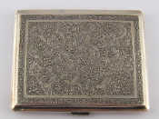 Appraisal: An Iranian silver cigarette card case standard assay with sprung