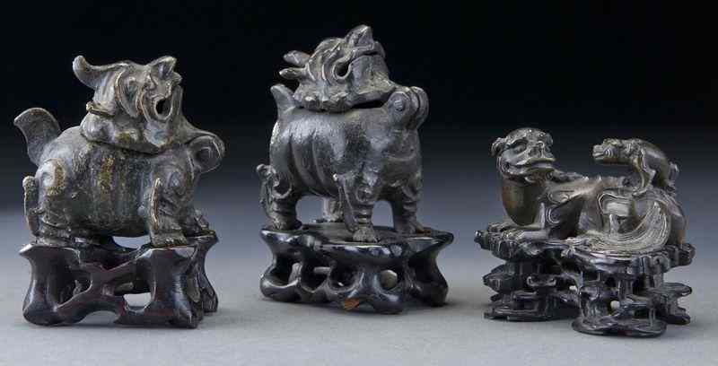 Appraisal: Chinese Qing bronze animals including unicorn censers and double lion