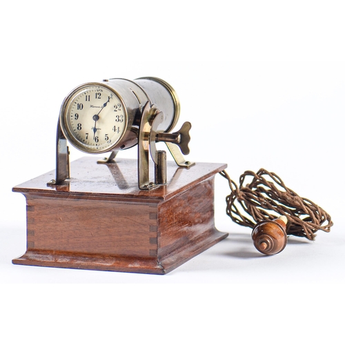 Appraisal: A brass and mahogany battery illuminated night projection timepiece Harrods