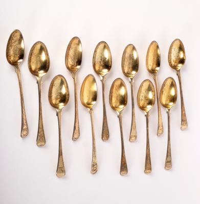 Appraisal: A closely matched set of twelve silver gilt dessert spoons