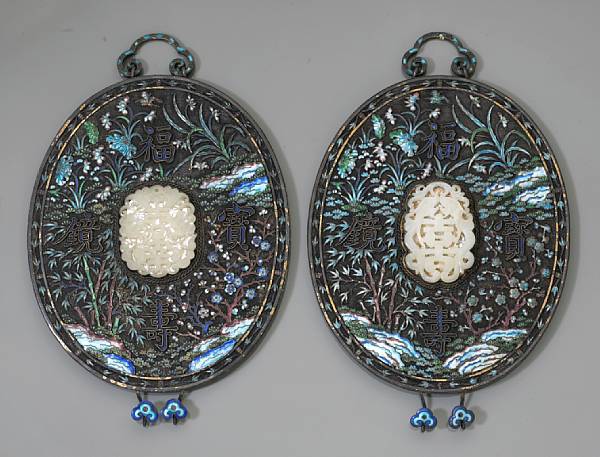 Appraisal: A pair of enameled silver mirror backs with jade mounts