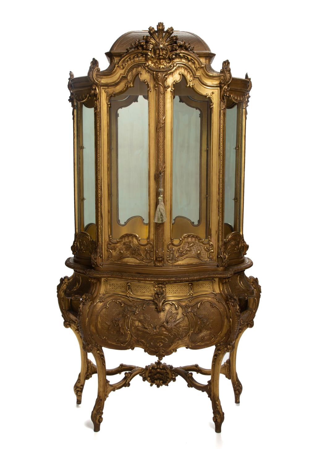 Appraisal: An Italian Rococo-style carved giltwood vitrine cabinet th Century The