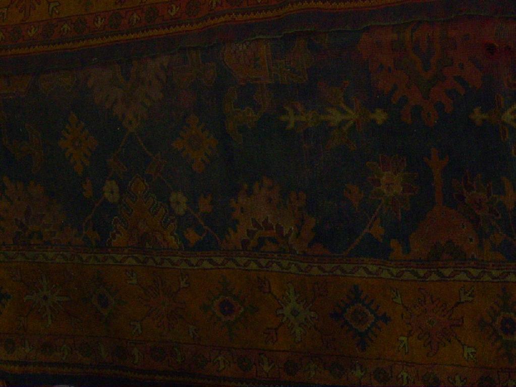 Appraisal: A large Edwardian wool carpet of Persian style with blue