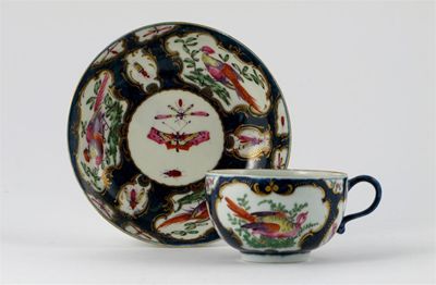 Appraisal: A Worcester teacup and saucer painted with gilt-edged panels of