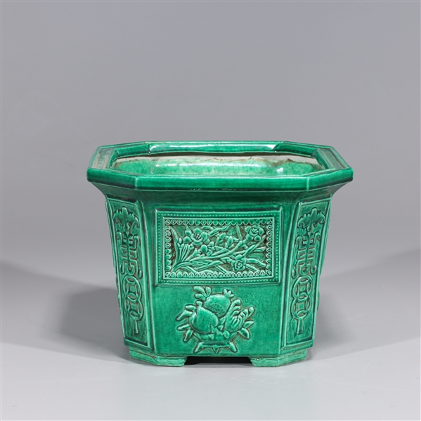 Appraisal: Chinese green glazed porcelain planter with molded designs and four