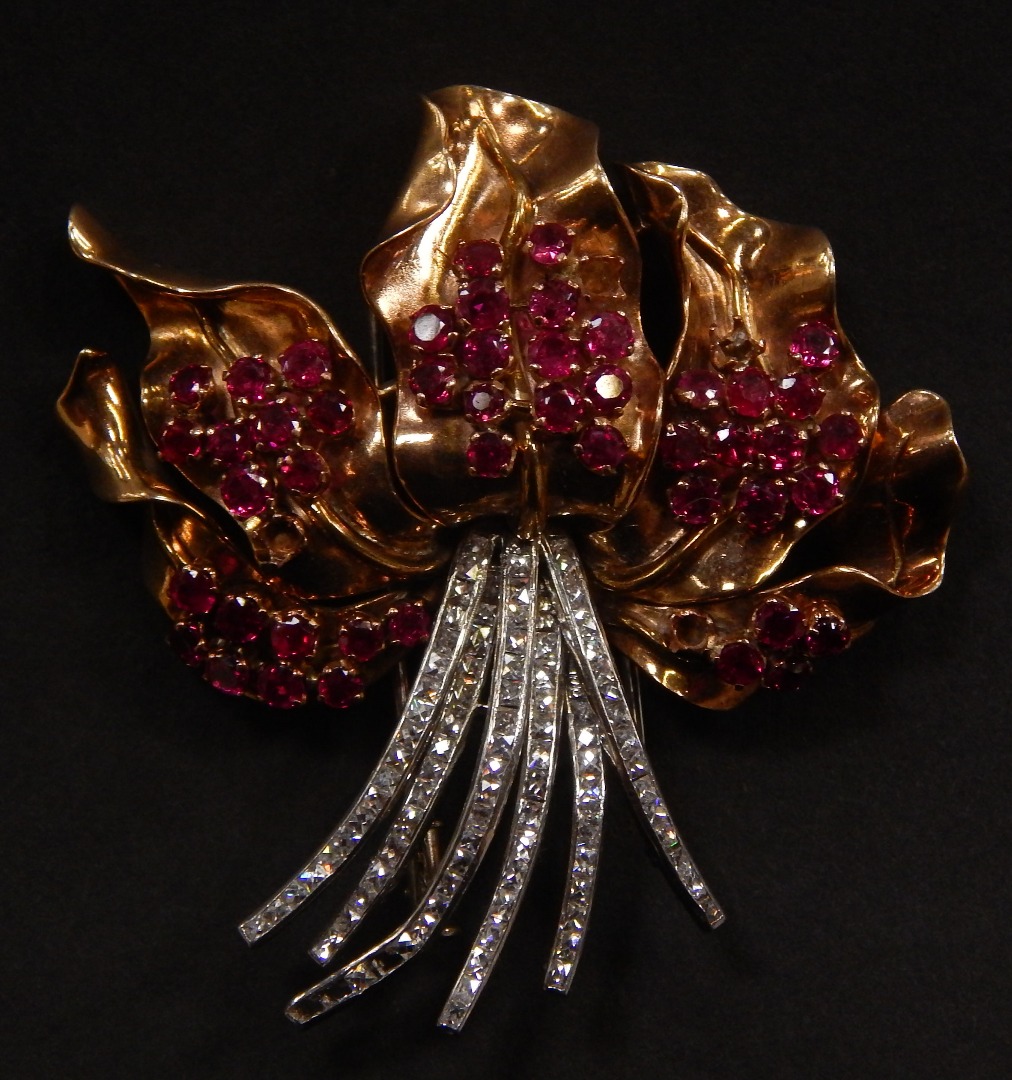 Appraisal: A Garrard yellow metal ruby and diamond flower brooch circa