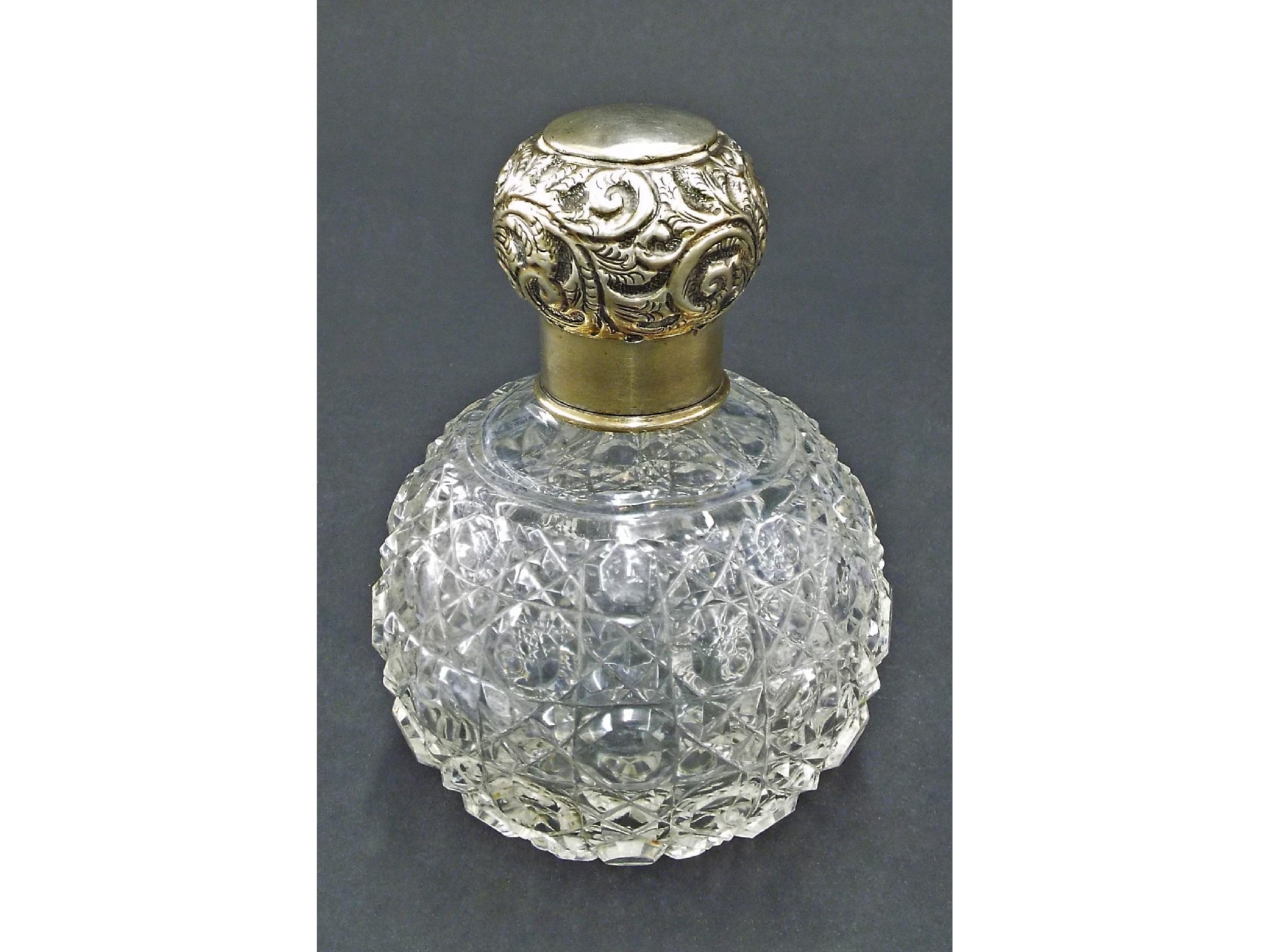 Appraisal: Silver lidded cut glass globe shaped scent bottle with stopper