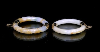 Appraisal: A Set of Two Rusty Color Jade Bangle Bracelets in