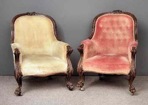 Appraisal: A pair of Victorian walnut framed spoon back easy chairs