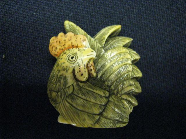 Appraisal: Carved Ivory Netsuke of a Rooster fine polychrome signed