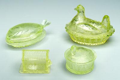 Appraisal: Four lidded vaseline glass dishes hen on basket with turned