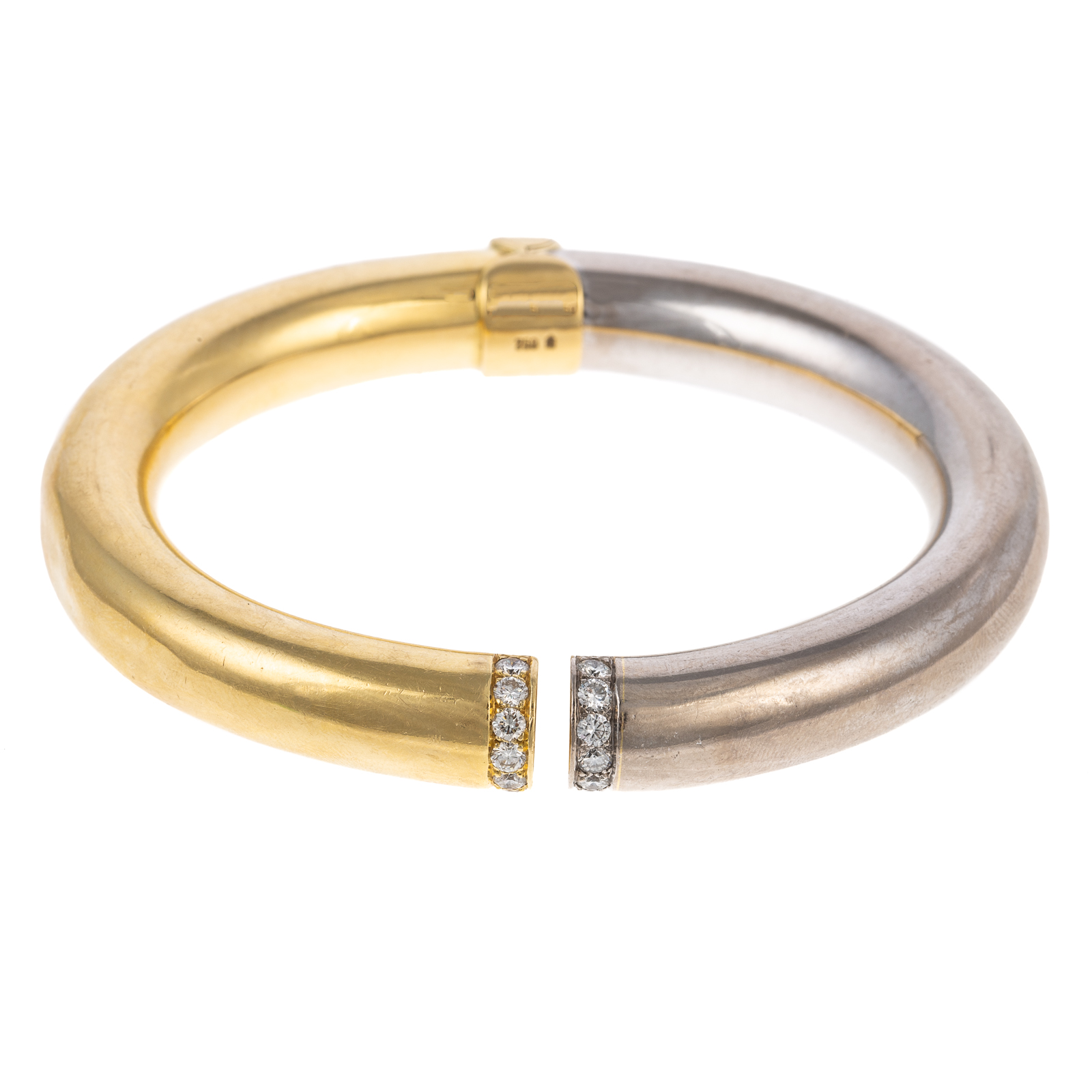 Appraisal: A BI-COLOR DIAMOND BANGLE IN K K yellow and white