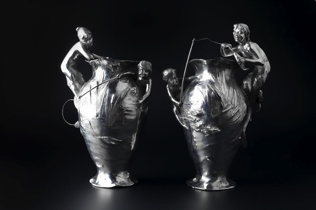 Appraisal: WMFPair of Art Nouveau silvered metal vases circa each modelled