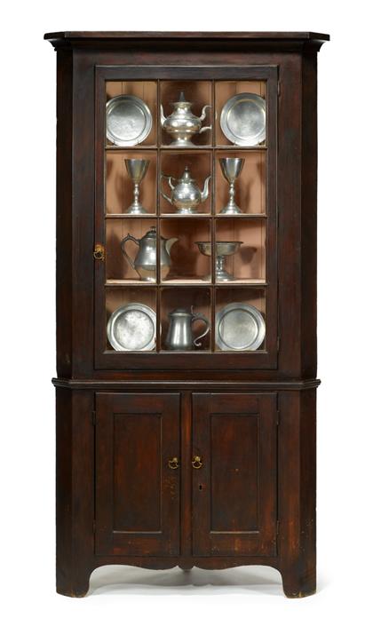 Appraisal: Dark stained two part corner cupboard early th century The