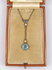 Appraisal: An Edwardian carat gold aquamarine and seed pearl pendant the