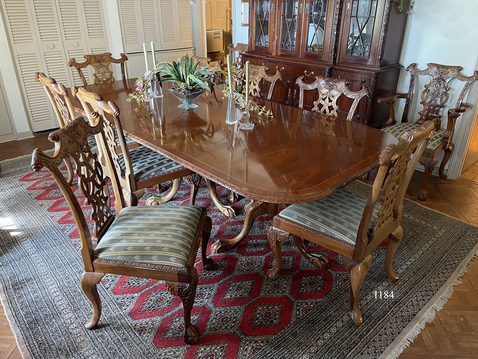 Appraisal: ELEGANT CARVED MAHOGANY DINING TABLE CHAIRS Banded dining table with