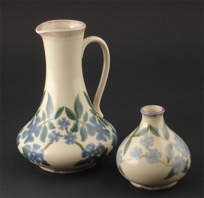 Appraisal: A Cobridge Stoneware vase painted with flowers in blue and