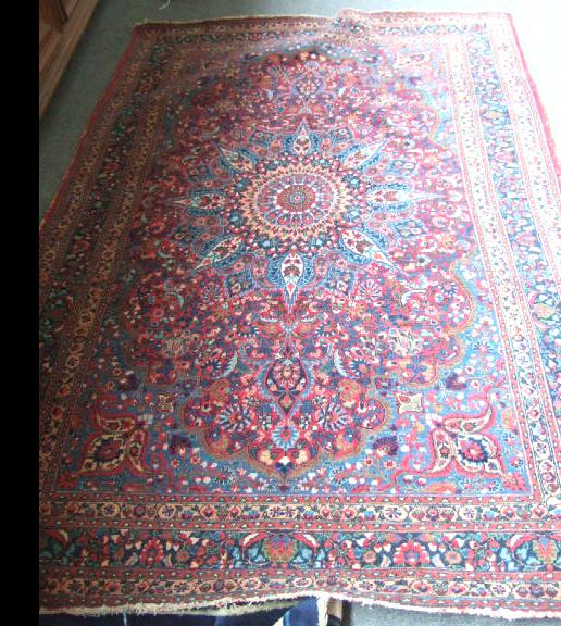 Appraisal: A Kashan rug Persian the madder field with rosette pole