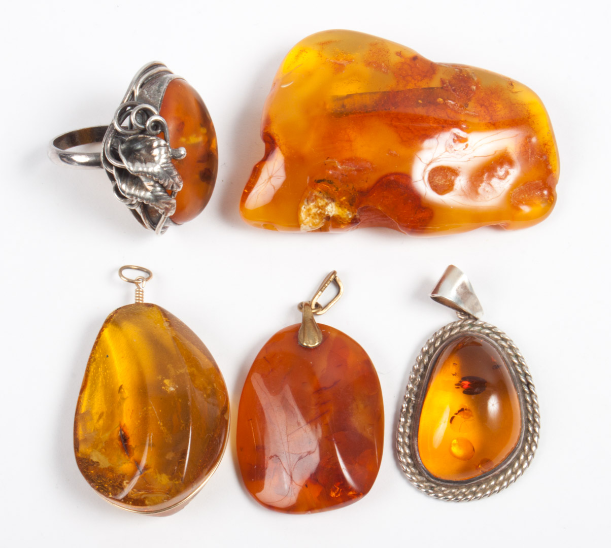 Appraisal: Five assorted amber jewelry items including sterling silver amber ring