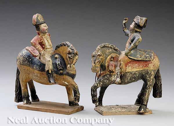 Appraisal: A Pair of Continental Carved and Polychromed Equestrian Figures of