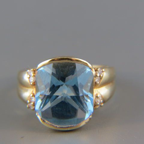 Appraisal: Blue Topaz Diamond Ring vivid carat fancy cushion cut gem