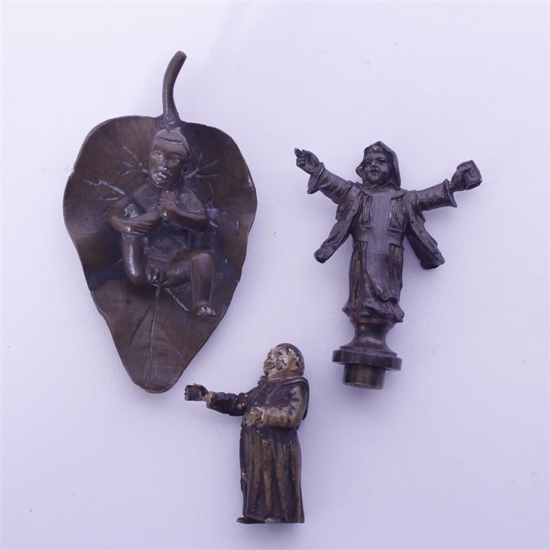 Appraisal: Three sculptural metal objects Cold painted Monk religious or fraternal