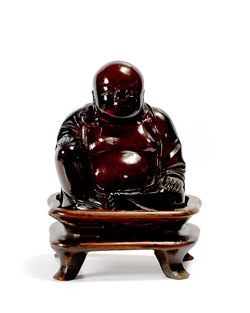 Appraisal: A Chinese red amberoid figure th Centuryin the form of