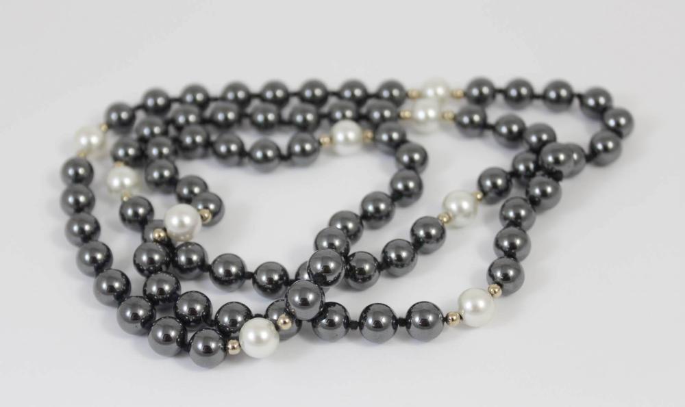 Appraisal: OPERA LENGTH HEMATITE AND PEARL NECKLACE - hand-knotted strand of