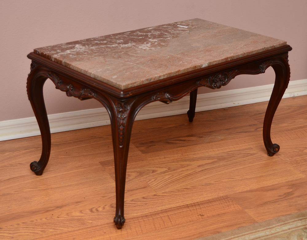 Appraisal: CARVED MARBLE TOP COFFEE TABLE Inset variegated marble top carved