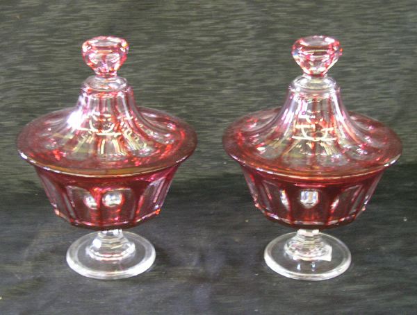 Appraisal: Attractive Pair of Bohemian Cut Ruby Overlay Glass Footed Covered