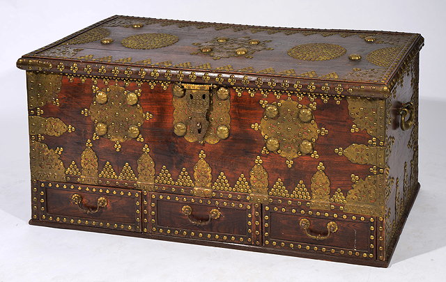 Appraisal: AN ANTIQUE HARDWOOD AND BRASS STUDDED ZANZIBAR CHEST with decorative