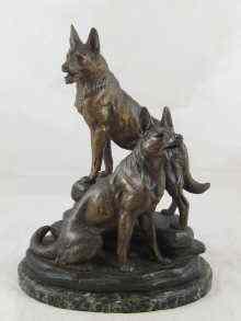 Appraisal: A spelter group of two German Shepherd dogs on a