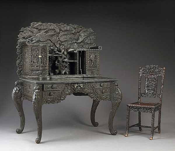 Appraisal: An elaborately carved export two-section wood desk Meiji Taisho Period