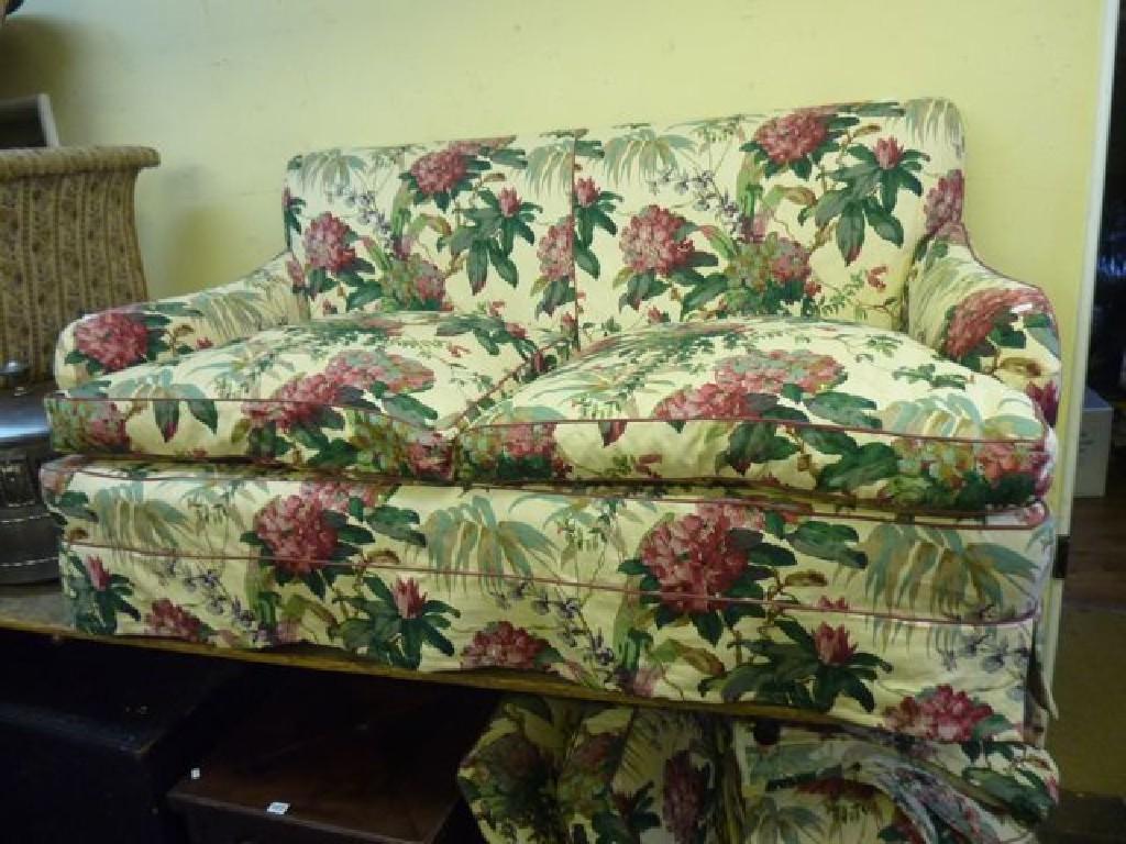 Appraisal: A Howard style low deep seated three seat sofa with