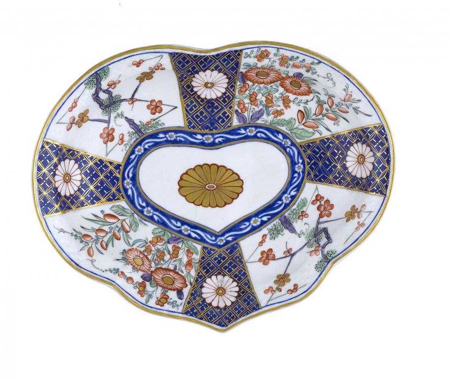 Appraisal: A DERBY DESSERT DISH with osier moulded border painted in