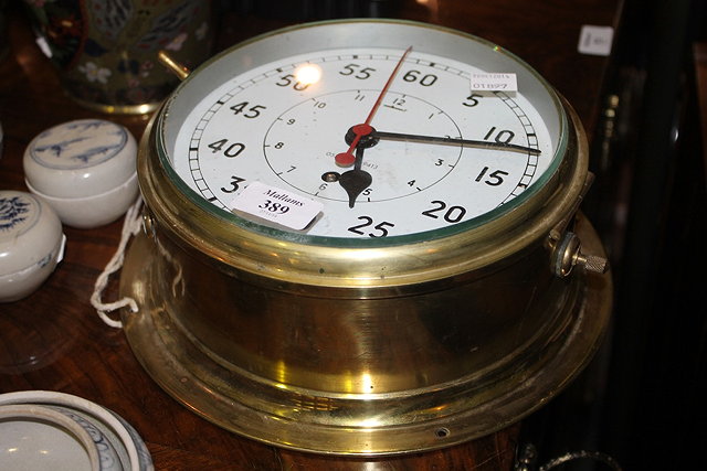 Appraisal: A BRASS CASED SHIP'S CLOCK cm diameter