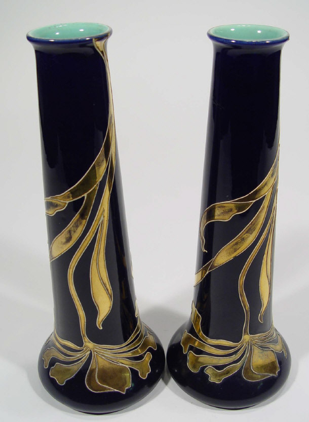 Appraisal: Pair of Sarreguemines Art Nouveau pottery bottle vases gilded with