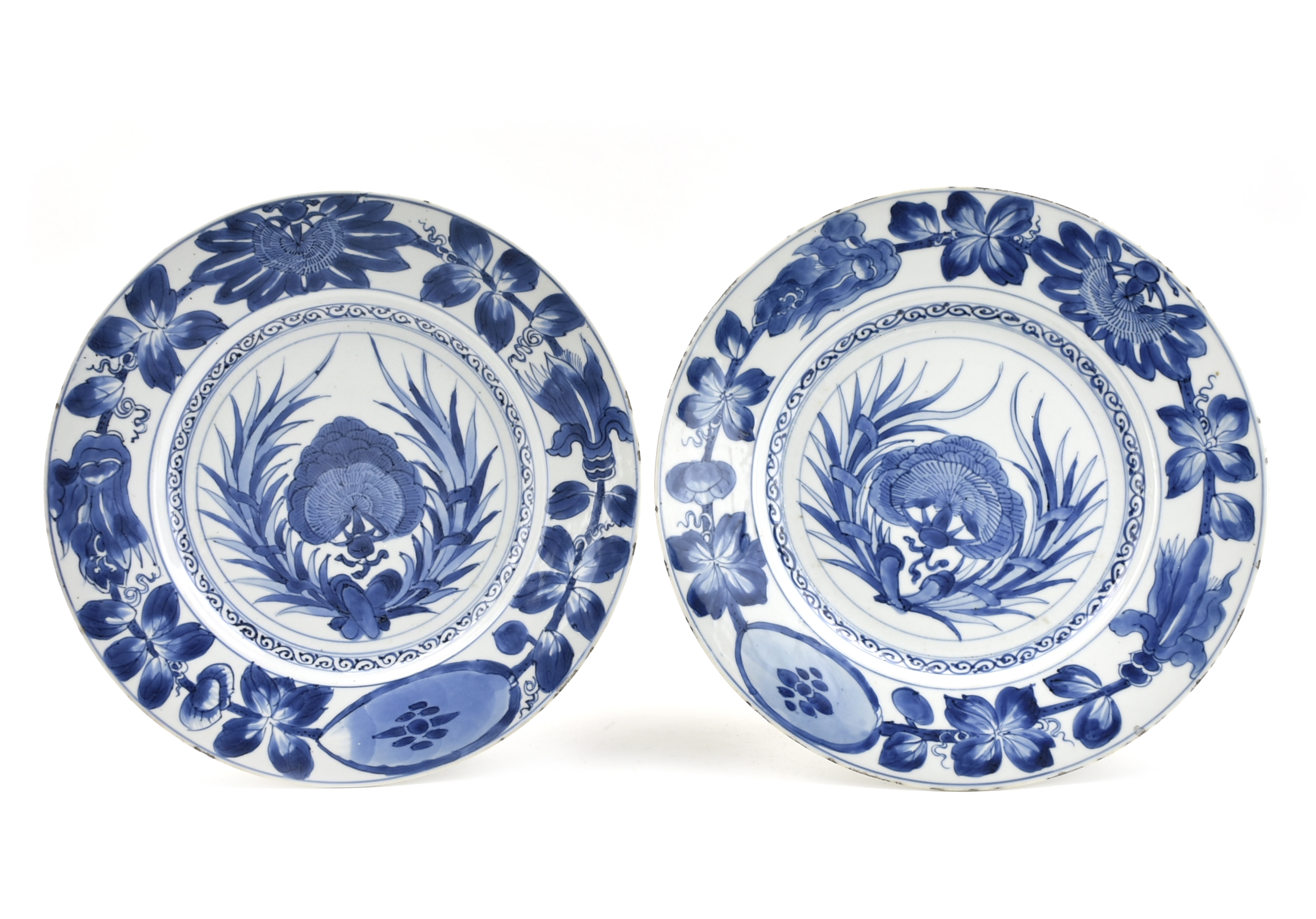 Appraisal: Chnese Kangxi Period blue and white chargers raised on a