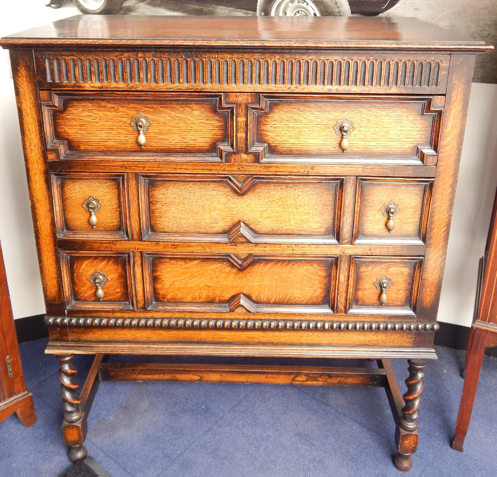 Appraisal: An early thC Jacobean style oak chest of three drawers