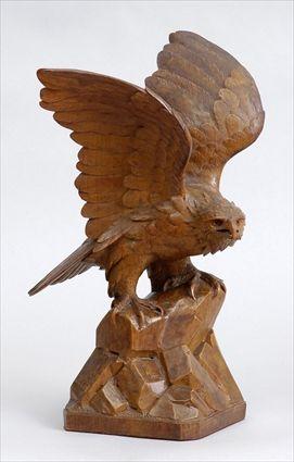 Appraisal: CARVED WALNUT FIGURE OF AN EAGLE Modeled with upraised wings