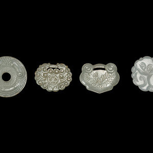 Appraisal: Four Chinese White Jade Pendants the first a circular form