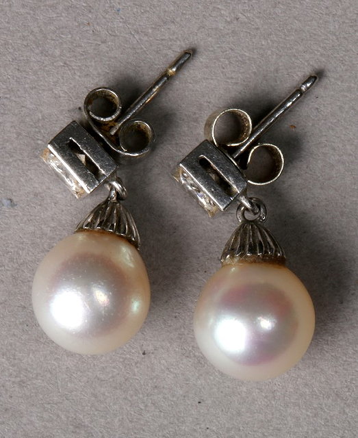 Appraisal: A PAIR OF CONTEMPORARY PEARL AND DIAMOND SET EARRINGS single