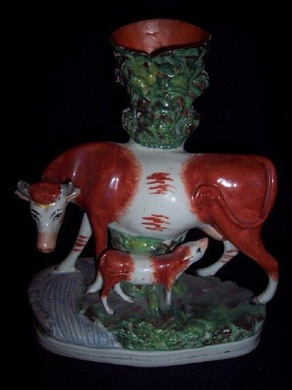 Appraisal: A Staffordshire vase with cow and suckling calf beside a