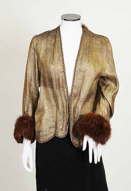 Appraisal: A s s gold jacket with embossed floral design brown