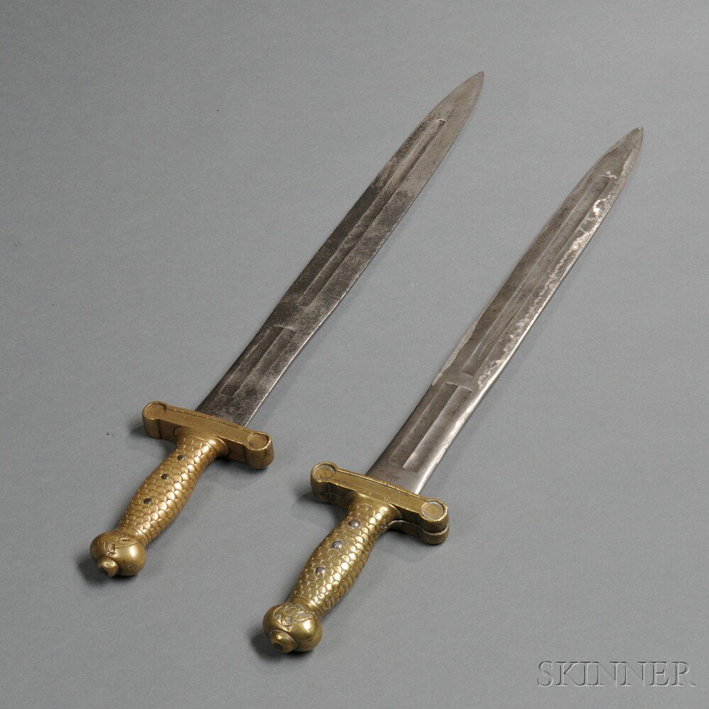 Appraisal: Two Model Foot Artillery Swords c - a brass-hilted sword