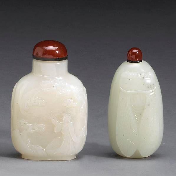 Appraisal: Two carved white jade snuff bottles th Century The first